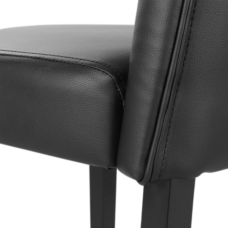 Two black PU leather dining chairs with buttons