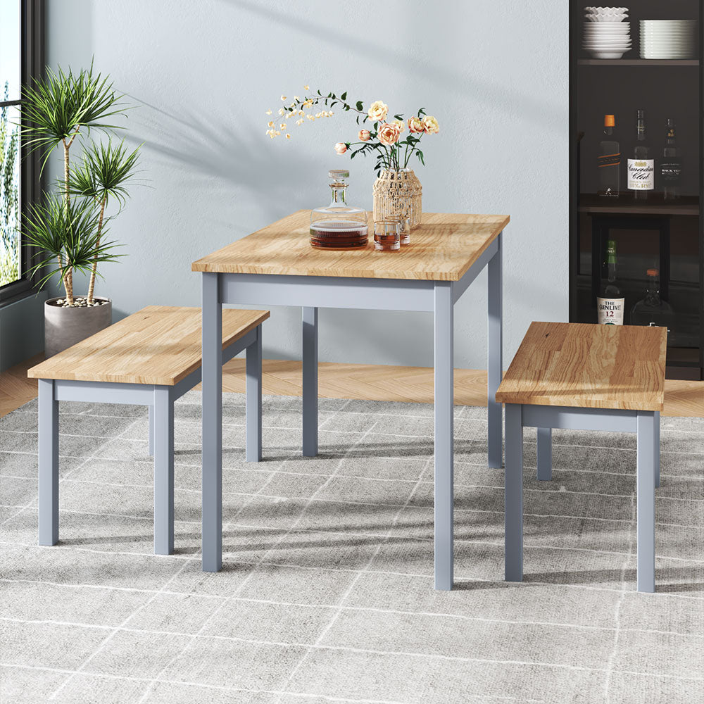 Three contemporary wood dining tables and benches in grey